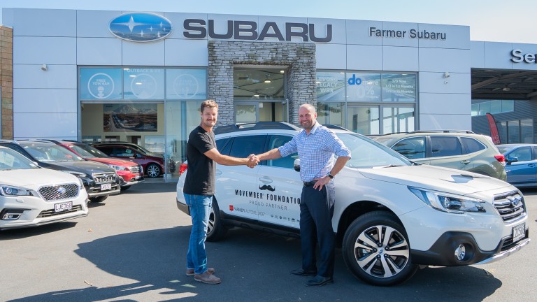 Movember Foundation New Zealand Manager Robert Dunne (left) picks up a Subaru Outback from Farmer Autovillage Group Managing Director Mike Farmer. 