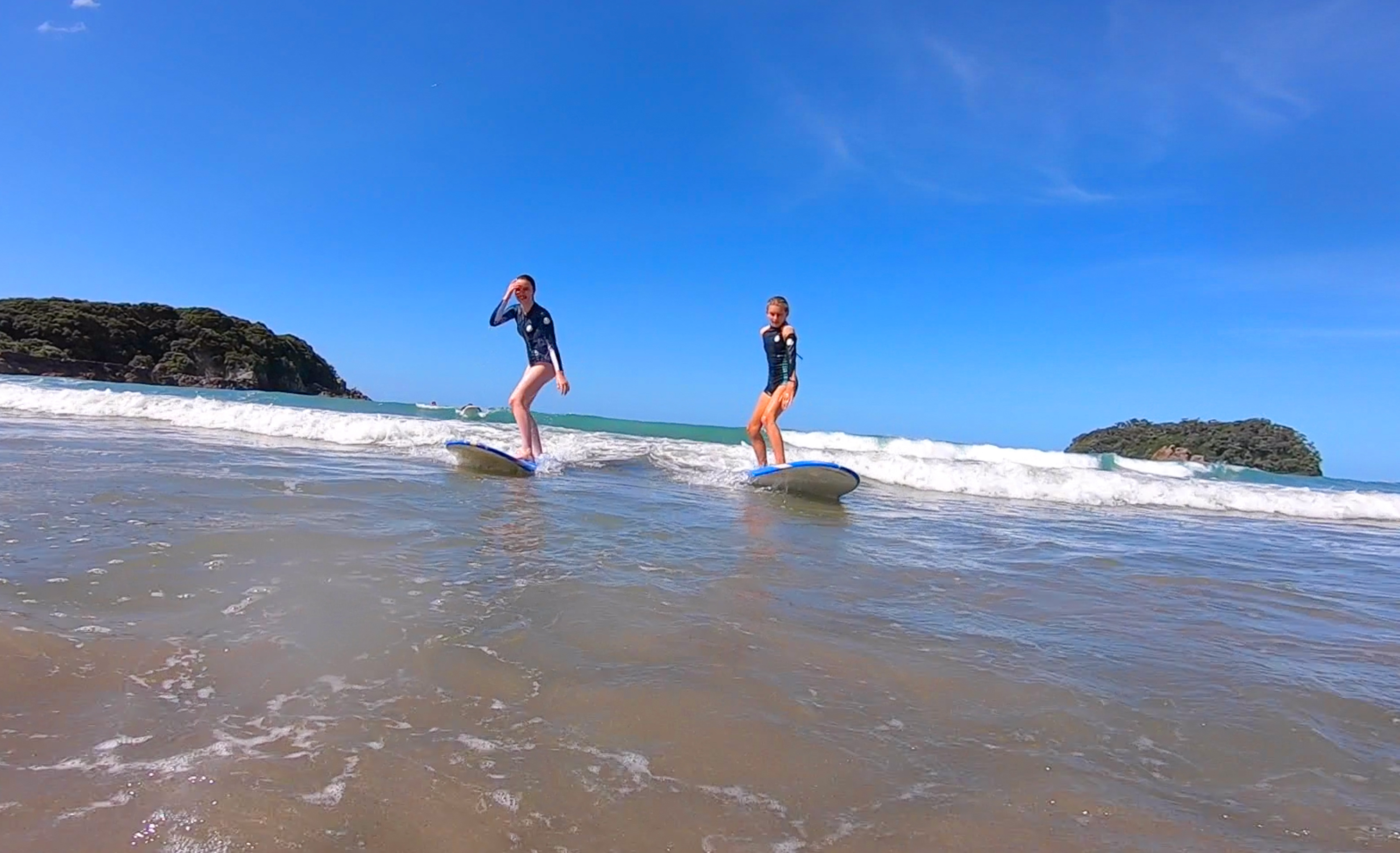 Grace and Sophie catching waves and learning to surf PC: Surf2Surf
