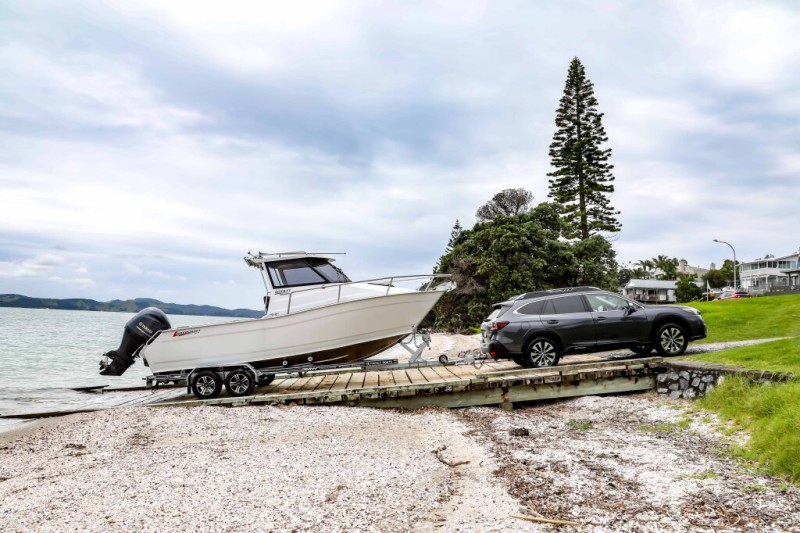 Subaru Outback XT towing boat off boat ramp at Omana Beach