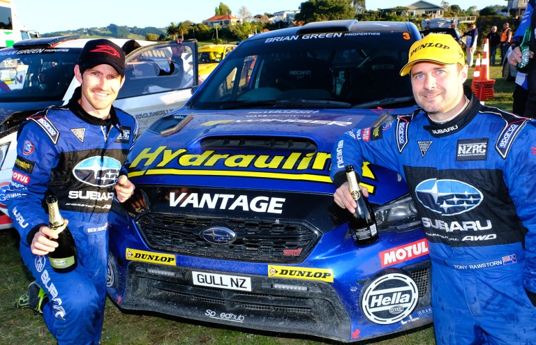 Subaru brand ambassador Ben Hunt (left) and his co-driver Tony Rawstorn celebrate next to their Subaru WRX STI after Hunt was second in the 2018 NZRC Driver's Championship and Rawstorn won the Co-Driver's Championship. PHOTO: GEOFF RIDDER.