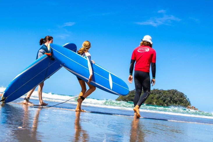 Kids can learn to surf with a professional instructor to help guide them. PC: Surf2Surf