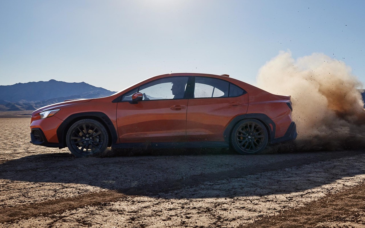 Black trim pieces, including the sport side garnishes on the front and rear fenders and the side sill spoilers feature hexagon patterned aerodynamic texture.