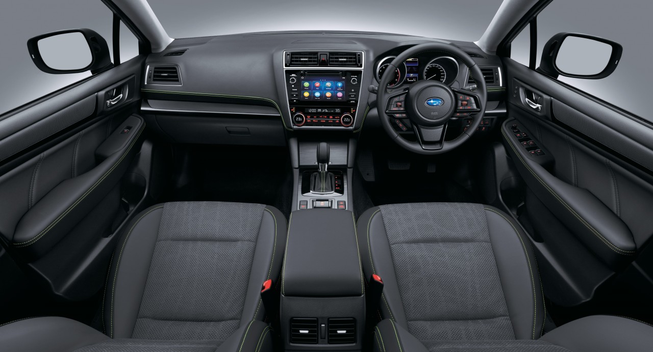 The Outback X's interior includes green stitching on the seats, centre console, steering wheel and gear shift boot.