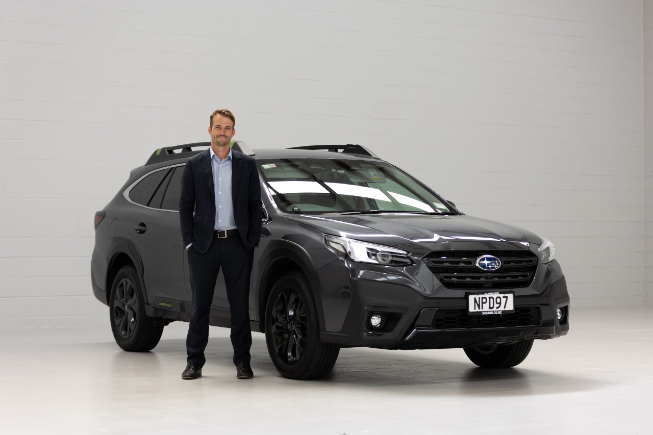 Manager Lucas Martin with Subaru's flagship model, the Outback.