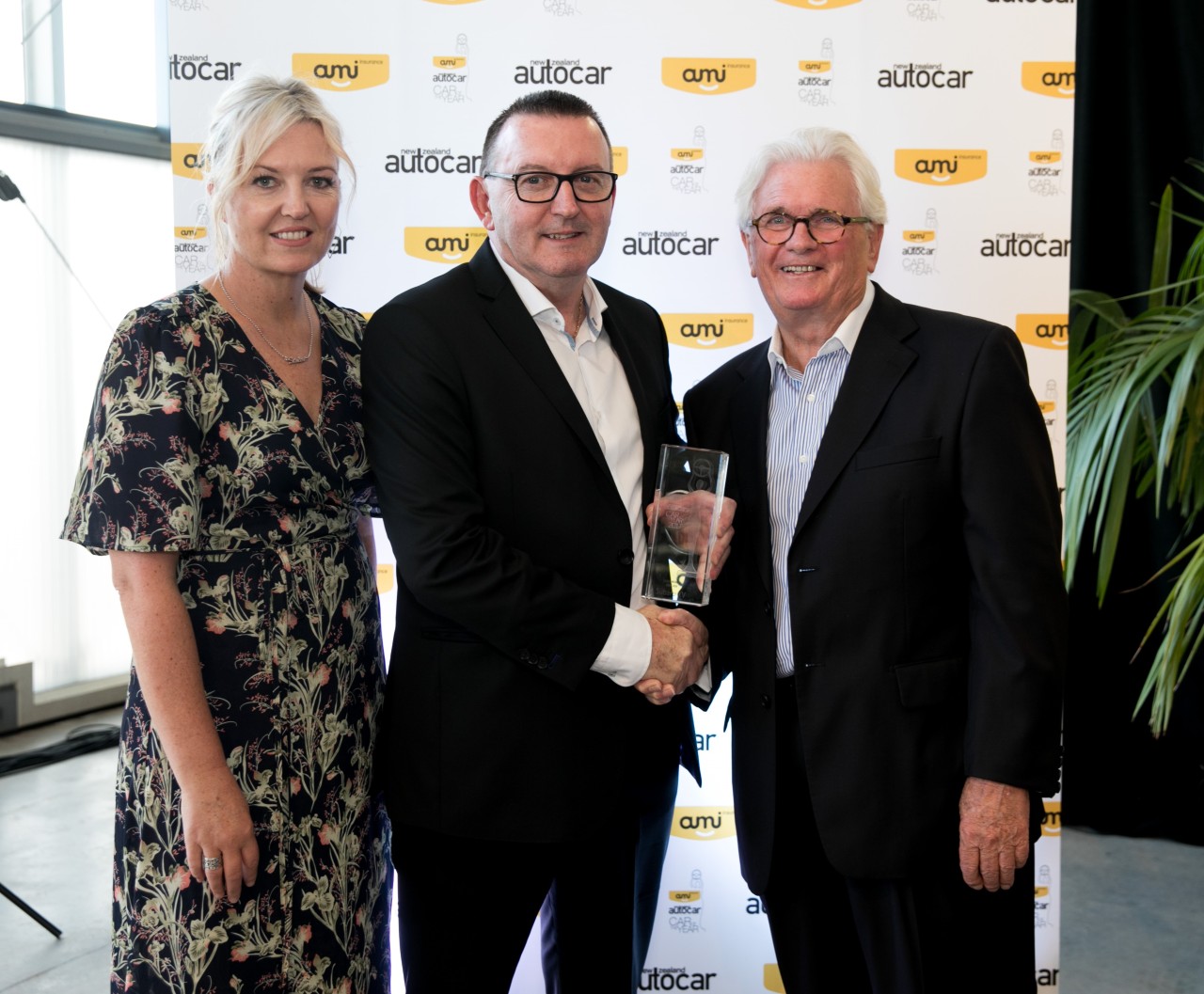 Subaru of NZ Managing Director Wallis Dumper (centre) receives the AMI Autocar class award for the Subaru XV from AMI Community Engagement Manager Eve Whitwell and NZ Autocar Publisher Mark Petch. PHOTO: CARMEN BIRD.