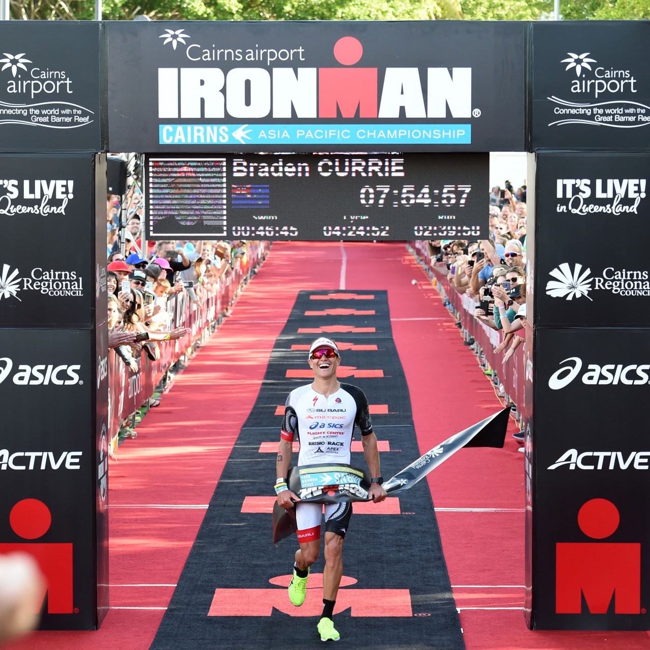 Braden Currie at the finish line as he wins Cairns Ironman 2018. Photo Credit Korupt Vision