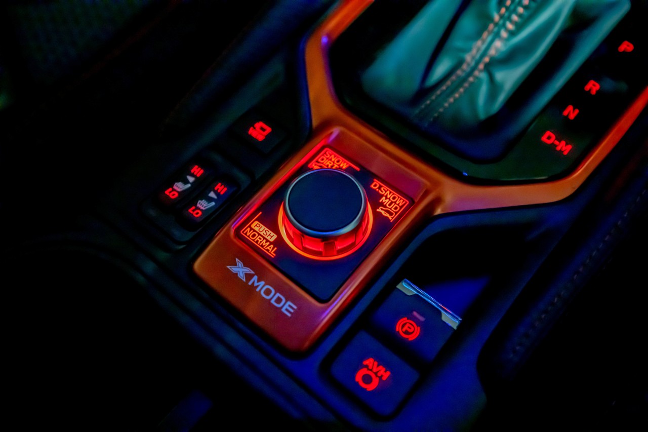 The Forester X Sport's interior features striking orange accents.