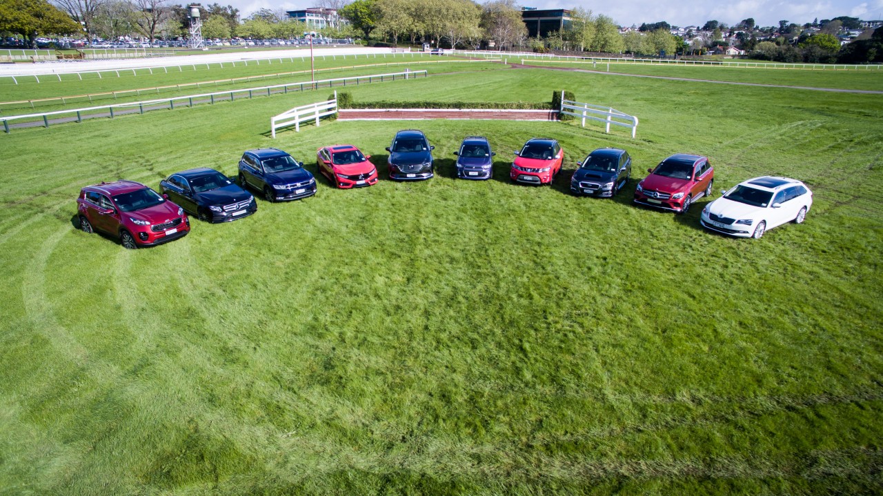 The 2016 New Zealand Car of the Year top 10 finalists take their marks on the track at Ellerslie Racecourse. From left: Kia Sportage, Mercedes-Benz E-Class, Volkswagen Tiguan, Honda Civic, Mazda CX-9, Holden Spark, Suzuki Vitara, Subaru Levorg, Mercedes-B