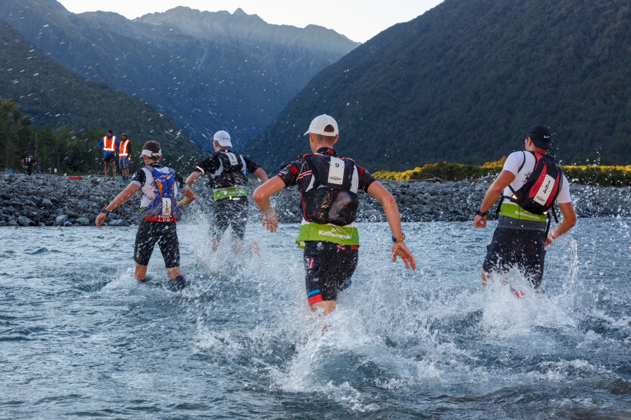 Runners make their way through the river on the run section of the Kathmandu Coast to Coast.