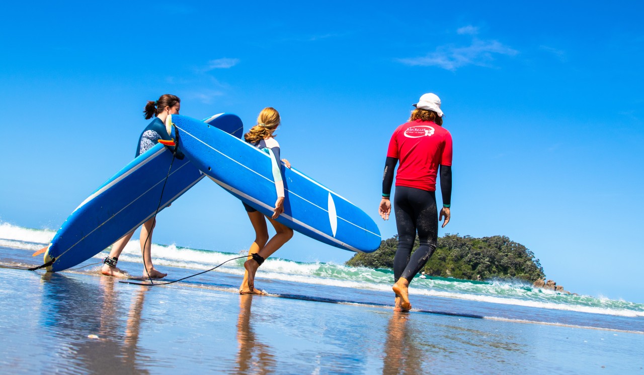 Kids can learn to surf with a professional instructor to help guide them. PC: Surf2Surf
