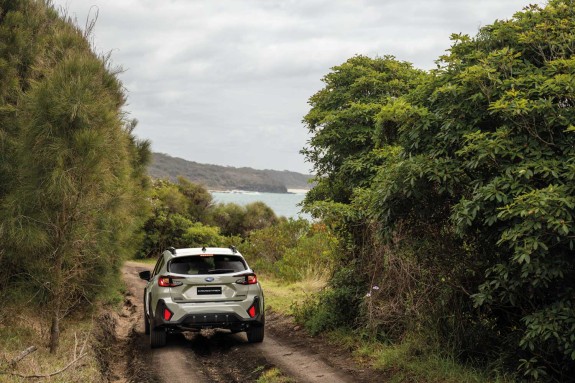 2026 Crosstrek Premium Rea driving down hill to beach