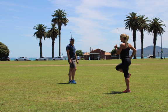 Subaru's Hannah Wells and Bevan McKinnon warming up and stretching.