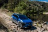 2026 Subaru Trailseeker Touring driving on rocky ground